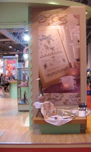 The giant photo of a sampler you can see here is one I designed!